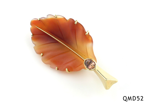 Seth & Reid Falling Leaves: QMD52 Orange dogwood leaf, 2 1/8” x 1” .53 oval smokey sapphire, 14kt yellow gold